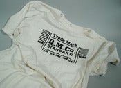 Image of QUALITY MENDING TRADE MARK LOGO FLOCKED SHIRT. OFF WHITE/ BLACK.