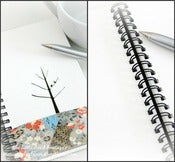Image of bird & tree notebook in oriental blossoms in blue