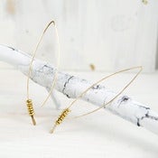 Image of gold crescent earring with brass nuggets s/m/l