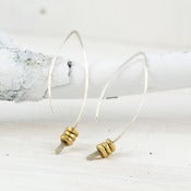 Image of silver crescent earring with brass nuggets s/m/l