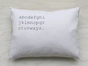 Image of alphabet pillow white