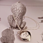 Image of heart locket with hand engraving