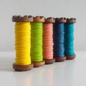 Image of Coloured Paper Twine On Vintage Wooden Bobbin