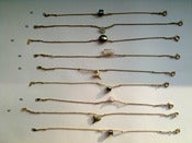 Image of brass bracelets with single charm/stone