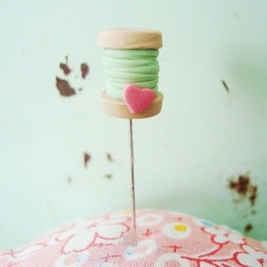 Image of baked pin - spool of thread