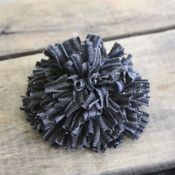 Image of ruffled mum pin - black and charcoal grey stripes