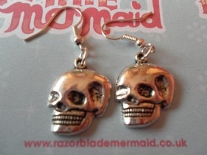 Image of Smiling Skull Shiny Silvertone Earrings