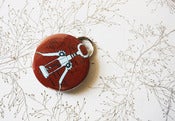 Image of corkscrew keychain bottle opener for wine snobs