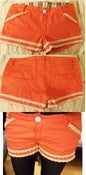 Image of coral lace trim shorts