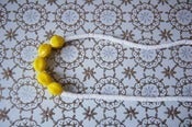 Image of necklace with yellow glass beads