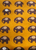Image of Yellow elephants organic interlock (by half metre)