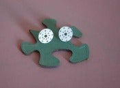 Image of  round silver studs, punched