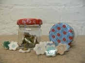 Image of Ceramic flower drawing pins in a Jar