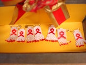 Image of Hand Made Beaded Red Ribbon Brooch