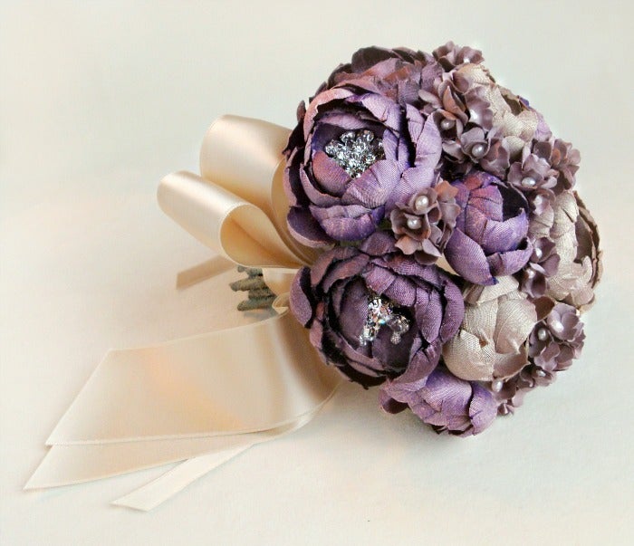 This silk fabric bridal bouquet is comprised of hand cut and formed silk 