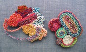Image of BRAIDED ECCENTRIC PIN