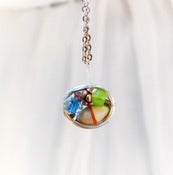 Image of Bird Nest Pendant with various beads
