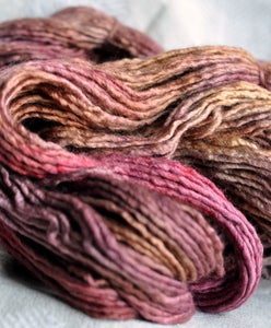 Image of tea steeped roses. gliding yarn. merino/silk worsted weight.