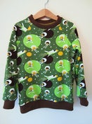 Image of Green Astronaut top