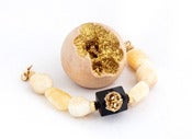 Image of Tumbled Calcite Stone Bracelet with Geometric Ebony Geode