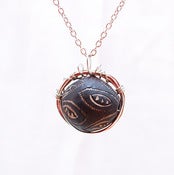 Image of Bird Nest Pendant with Glass Bead from Ghana