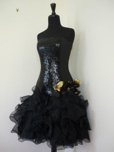 Image of black sequined party dress w/ ruffled skirt