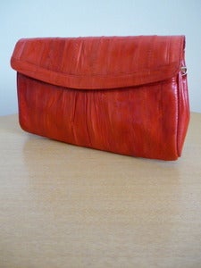 Image of cherry red eelskin clutch handbag
