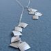 Image of suitcase necklace