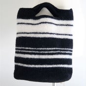 Image of black & white felted handbag