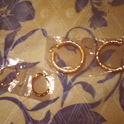 Image of Two pairs of golden hoop earrings 