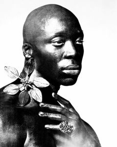 Image of Black male portrait with jewellery