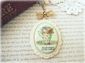 Image of Long Necklace with Cream Teacup Pendant, Gold Bow & Chain 