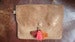 Image of Polder pochette rouille irisée à pompons