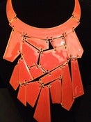 Image of Orange puzzle piece necklace