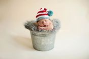 Image of Red Striped Hat With Tassel or Pom-Pom