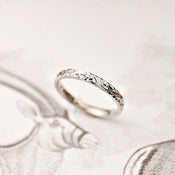 Image of platinum 2mm flat court floral engraved