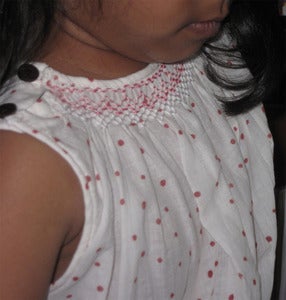 Image of Nissin Sleeveless smocked dress