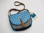 Image of -- S O L D -- a small cross body bag with a sky with and white polka dot flap