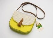 Image of -- S O L D -- a small cross body bag with canary yellow teeny sunburst print flap