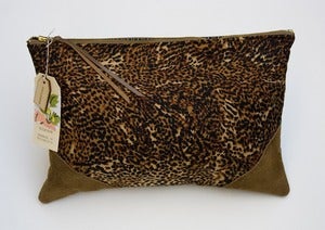 Image of -- S O L D -- an oversized clutch in leopard print with leather corners