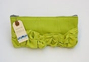 Image of a roundy-bottomed tough ruffles zipper purse in bright celery greens