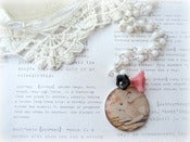 Image of White Beaded Necklace with Bunny Pendant and Peach & Black Flowers 
