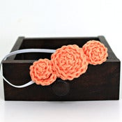 Image of Three Rosette headband in Cantaloupe