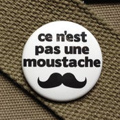 Image of this is not a mustache homage button
