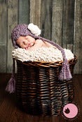Image of Pixie Bonnet in Purple with cream fabric flower