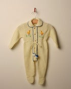 Image of c. 1960s knitted romper with pom poms