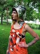 Image of orange tiger with liquid silver and gold hood