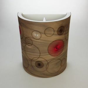 Image of Walnut wall light. Random Circles.