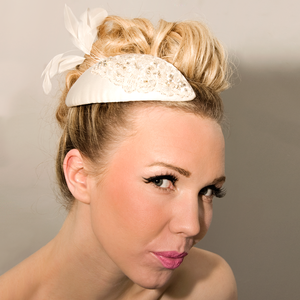 Image of Teardrop shaped bridal fascinator with crystal, bead and feather embellishment.