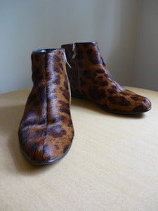 Image of animal print pony flat ankle boots